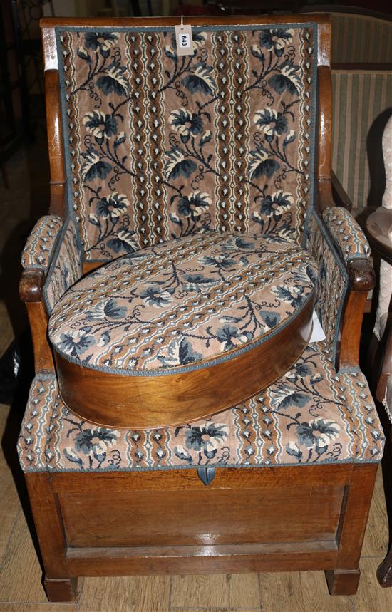 A 19th century French walnut commode chair, with an oval footstool, W.2ft 1in. H.3ft 6in.